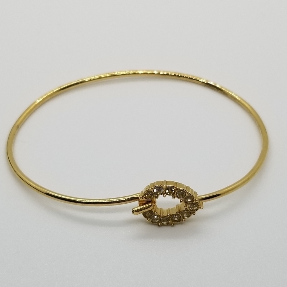 gold tone bracelet with pave rhinestone teardrop clasp
